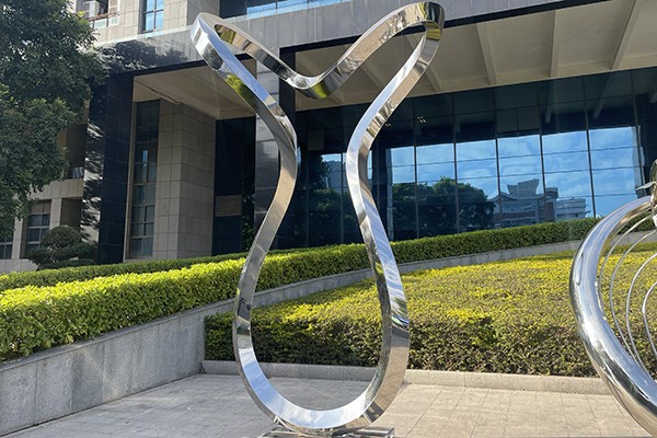 Polished Stainless Steel Abstract Flowing Sculpture for Outdoor Spaces